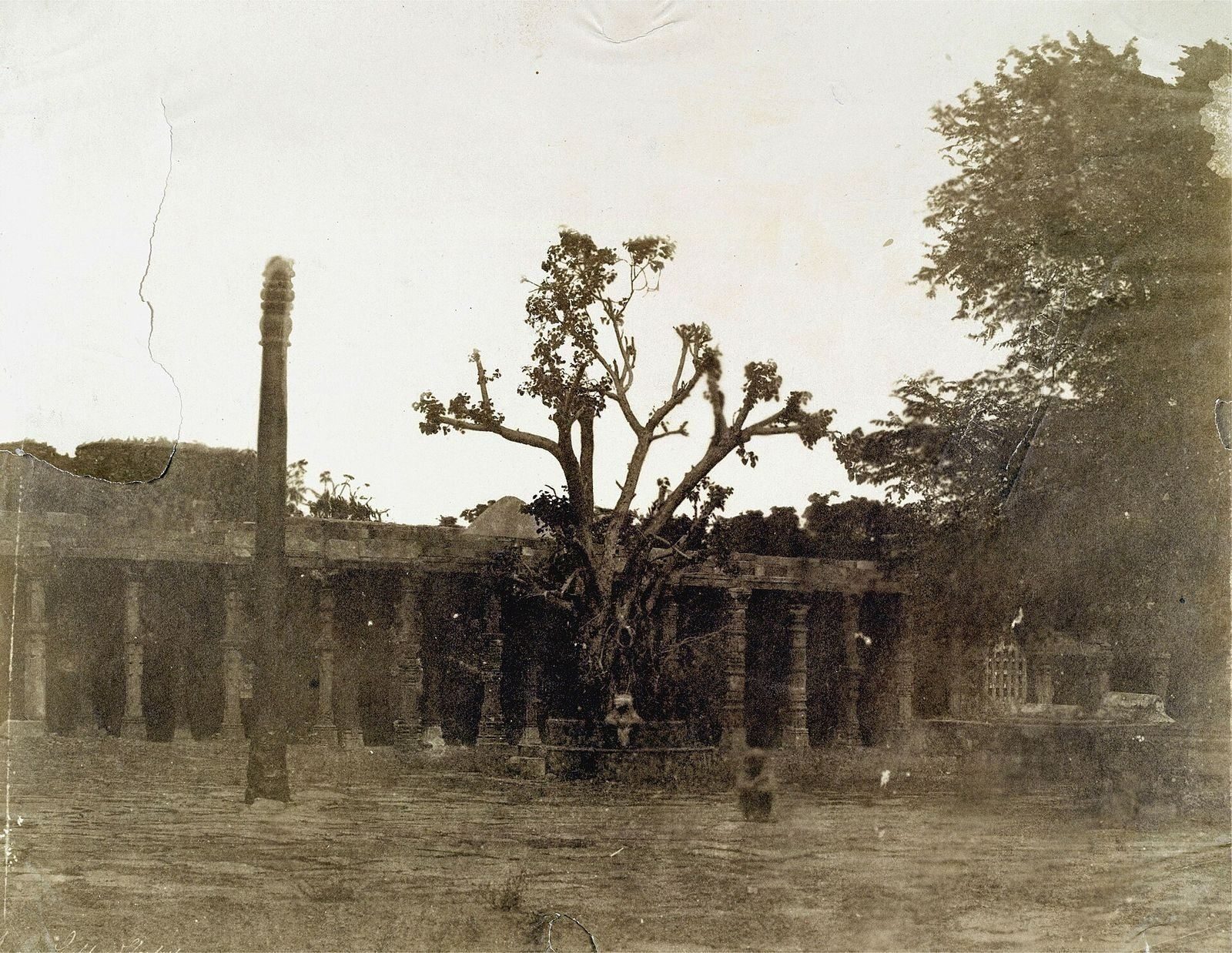 The iron pillar of Delhi photographed in 1858 — raised under the Gupta emperor Chandragupta II around 400 AD