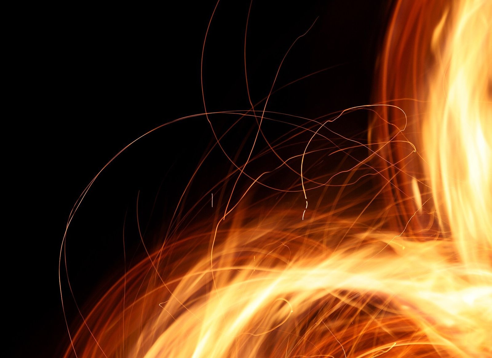 A campfire throwing sparks into the night in Anttoora, Finland
