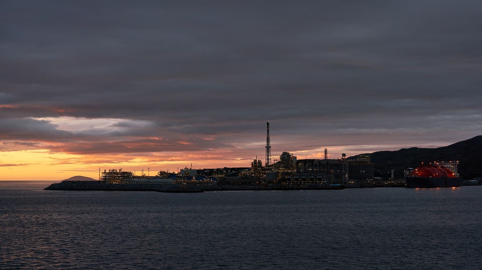 An LNG tanker docked at a liquefied natural gas terminal