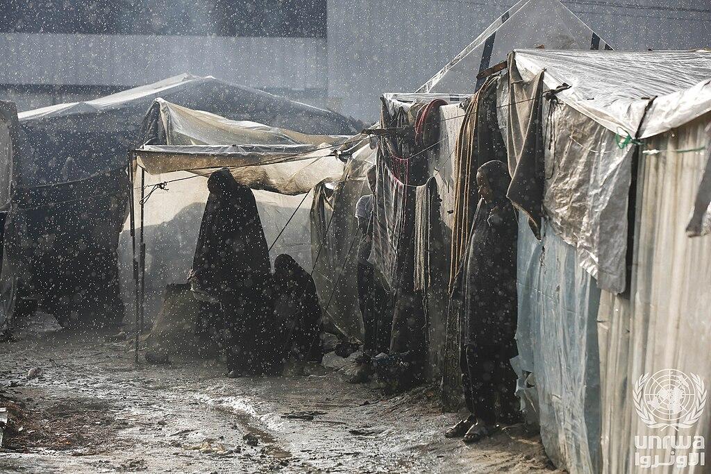 Flooded tents of displaced Palestinians in Deir el-Balah, Gaza Strip, under heavy rain
